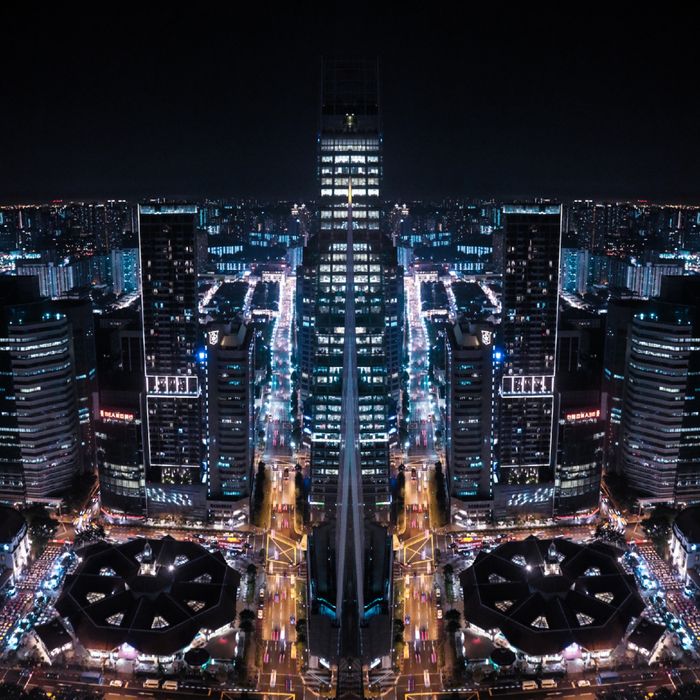 A stunning architectural display of Singapore's urban skyline at night, beautifully illuminated.