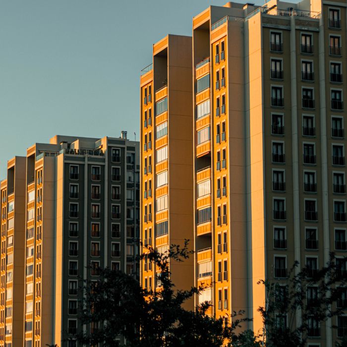Sunset view of residential skyscrapers with warm lighting creating an inviting urban atmosphere.