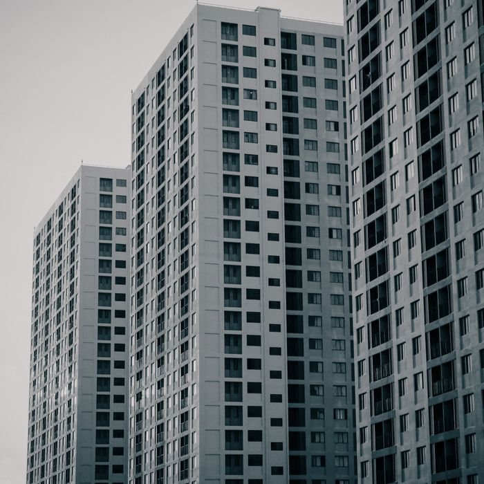 Monochrome image of modern skyscrapers showcasing urban architecture in daylight.